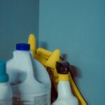 A close up of a bottle of cleaner next to a mirror